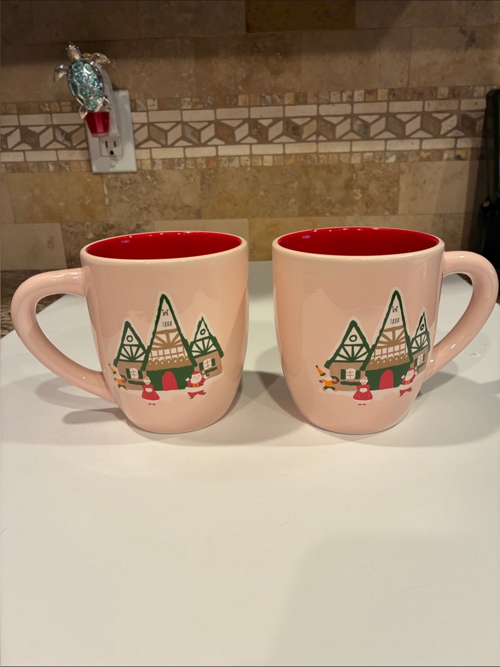 Wolferman's Bakery Christmas Village Coffee Mugs Pink Red Set of 2